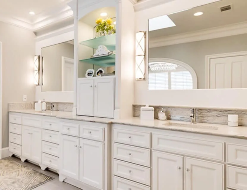 Kitchen with marble-look slab backsplash and brass hardware
