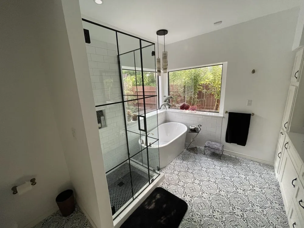 Modern bathroom with a black-frame glass shower