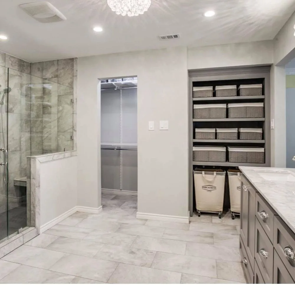 Spa-style bathroom with patterned tile flooring